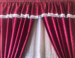 Wine colored blind curtain with Voile behind.